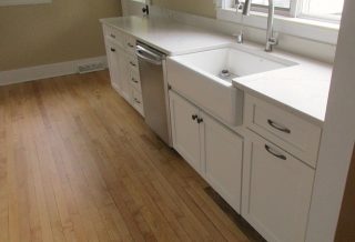 Deep ceramic kitchen sink and maple floors in kitchen remodel in Champaign IL