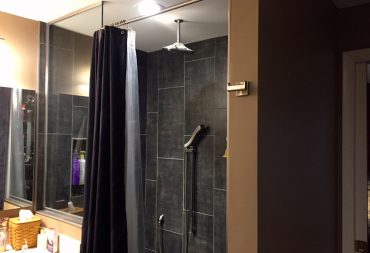 Elegant tiled curbless shower bathroom remodel