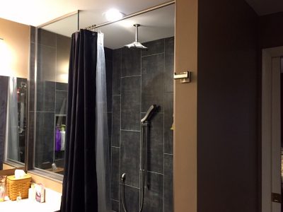 Elegant tiled curbless shower bathroom remodel