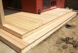 Cedar deck on New two-story home addition on Tudor Revival home in Urbana IL