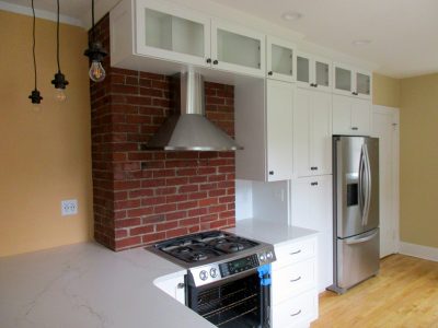 Kitchen remodel with brick chimney accent by general contractor New Prairie Construction Co.