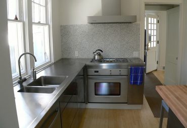 Stainless steel range and hood in kitchen remodel in Champaign