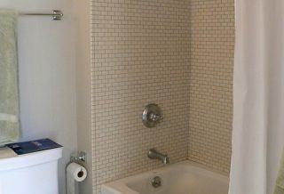 Tiled shower and tub in master bath in New two-story home addition on Tudor Revival home in Urbana IL
