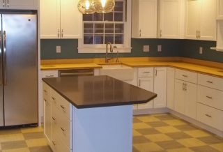 Marmoluem flooring, bamboo countertops, recycled paper island countertop in an eco-friendly kitchen remodel in Champaign IL.