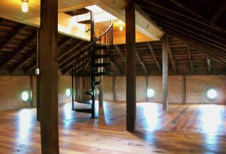 Remodeled attic and spiral staircase in historic restored Victorian farmhouse in East Central IL