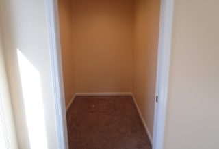 Bedroom closet with crawlspace entry in home addition in Urbana IL