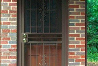 Decorative storm door on Brick home addition project in Urbana IL