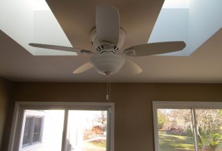 Ceiling fan between skylights in home addition in Urbana IL