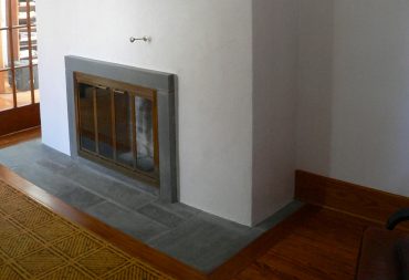 Restored plaster chimney with bluestone fireplace surround