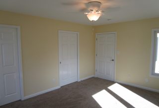 Closet, bathroom and entry doors in bedroom addition