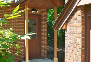Covered entrance to garage in Brick home addition project in Urbana IL