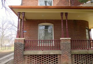 Wooden porch posts and railings on award-winning historic preservation construction project