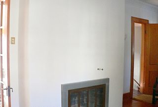 Restored plaster chimney with bluestone fireplace surround