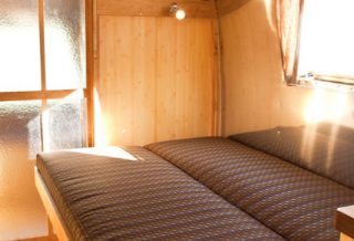 Pull-out bed in Vintage Airstream remodel