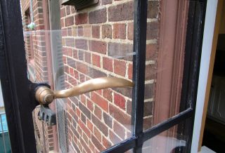 Refinished hardware for rolled steel window restoration project in Champaign IL
