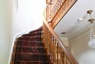 Restored stairwell in historic restoration of Victorian farmhouse in East Central IL