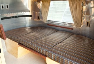 Sleeping area in Vintage Airstream remodel