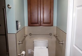 ADA compliant toilet area with grab bars in home addition in Urbana IL