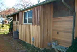 Exterior cedar siding renovation project by general contractors New Prairie Construction in Champaign, IL.