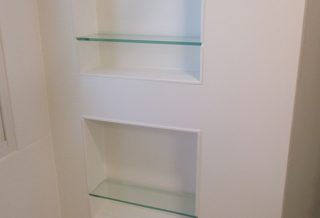 Recessed glass shelving in bathroom remodel in Champaign, IL.