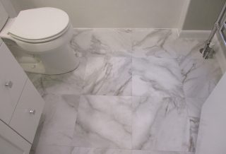 Luxury vinyl tile flooring in bathroom remodel in Champaign, IL.