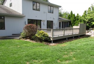 A partial deck remodel project in West Champaign IL replacing wood deck boards, railings and wall claddings with composite materials.