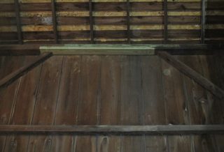 Timbers, gable vents, floor boards, and siding were replaced, and a new stairwell and guard rails were constructed in this unique barn restoration.