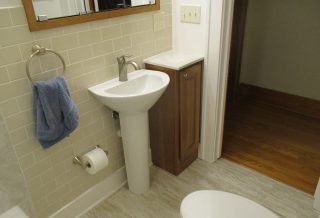 Pedestal sink in bathroom remodel in Champaign, IL