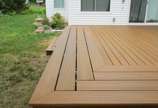 Low maintenance, composite deck with benches built by general contractor New Prairie Construction in Champaign, IL.