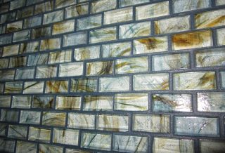 Mosaic tiles in bath in bathroom remodel project in West Urbana, IL.