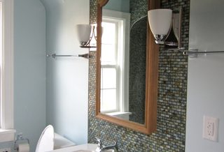 Tiled sink area in bathroom remodel project in West Urbana, IL.