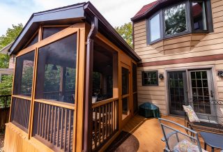 Angled deck with screened in porch construction in West Urbana, IL