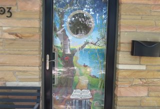 Mural Door by Glen C. Davies, installation by New Prairie Construction Co.